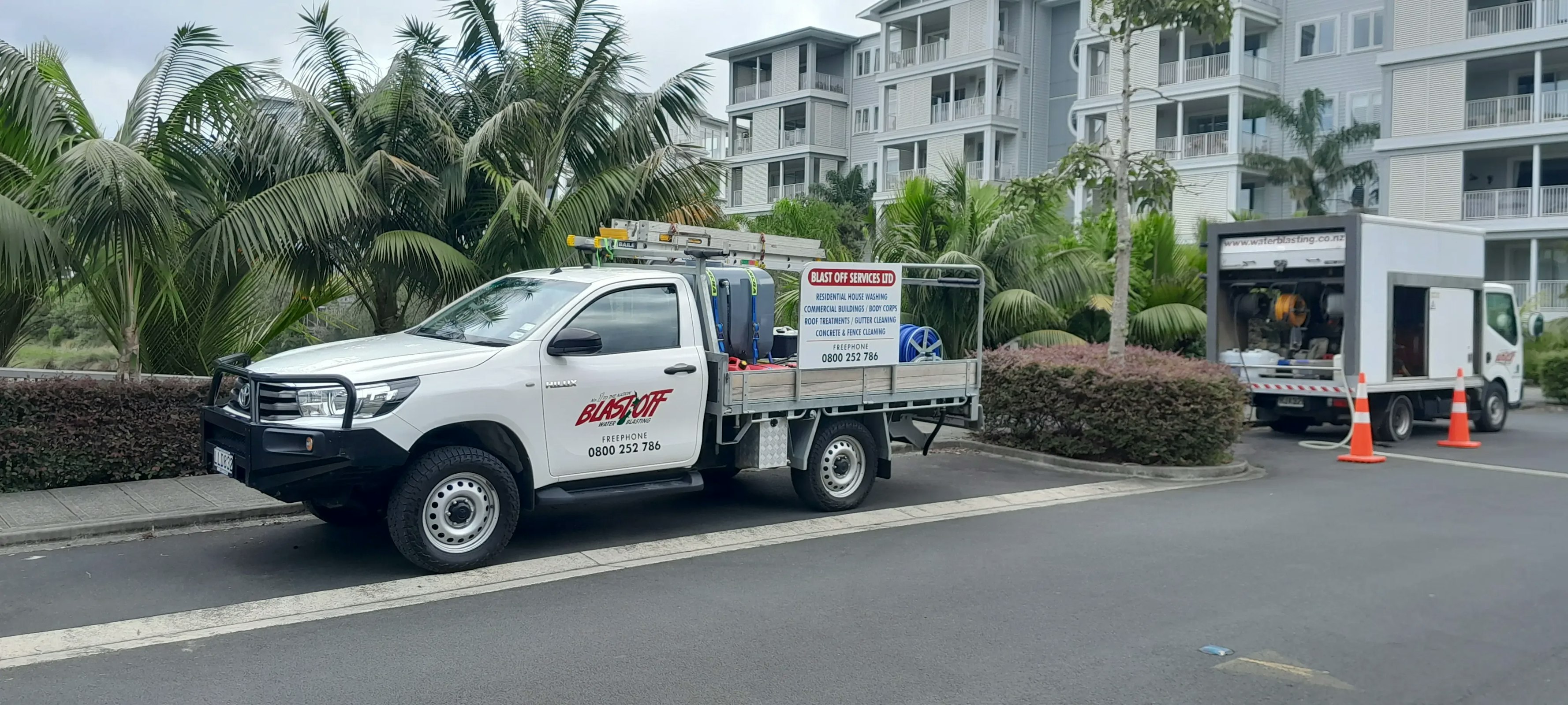 Blast Off Water Blasting Services soft washing an apartment building in Orewa.